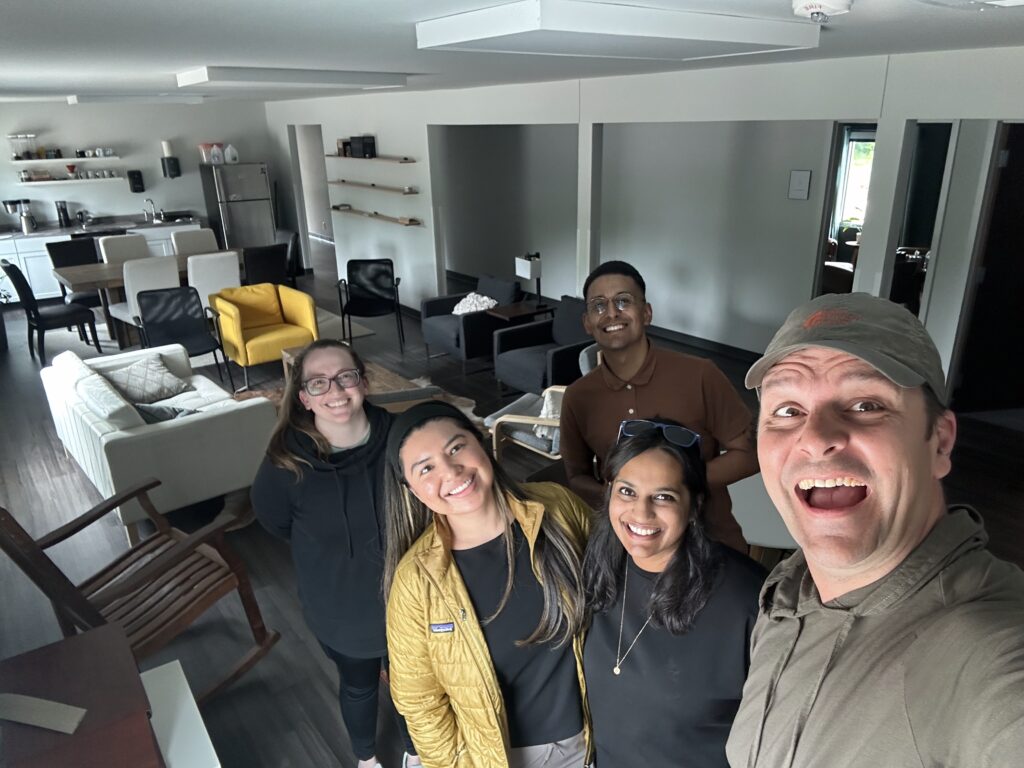 Matt Newman and Gilbert Gonzalez showing Christina Foor, Lynette MacIntosh-Madrigal, and Sarah Callen around Samartian Church